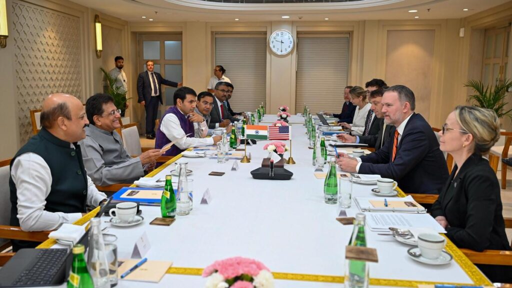 Indian and American flags displayed together during high-level trade negotiations in New Delhi, symbolizing stronger economic cooperation and growing bilateral relations.